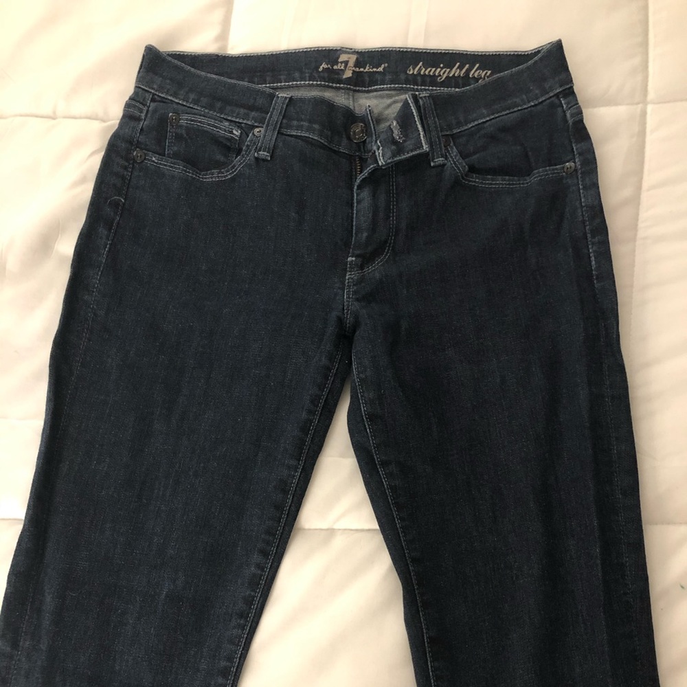 Lightly worn dark blue 7 straight leg jeans.